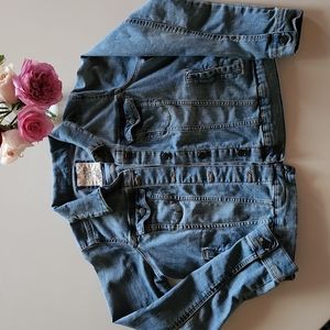 Small Jean jacket with pockets on the outside and inside of jacket.